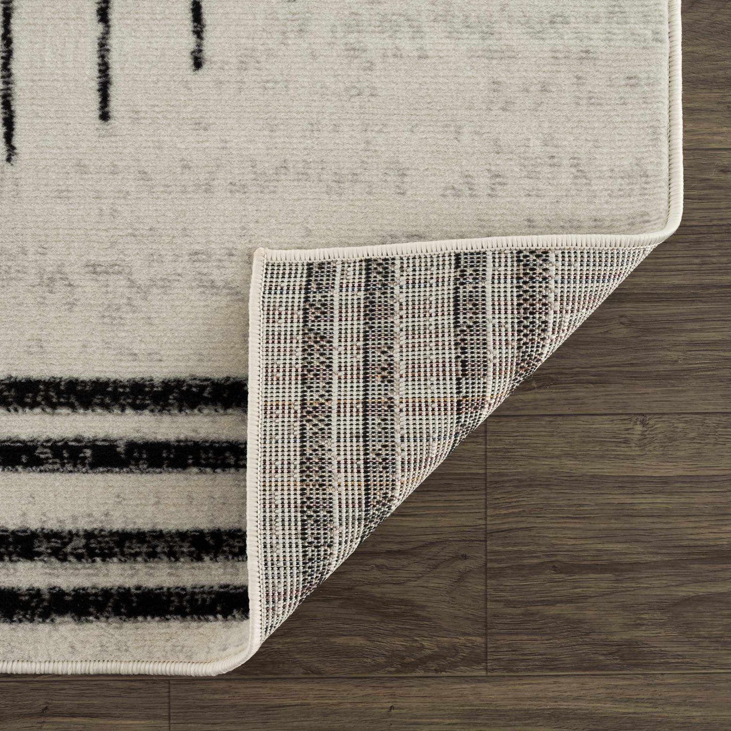 Angus Abstract Black and White Area Rug Hauteloom LLC