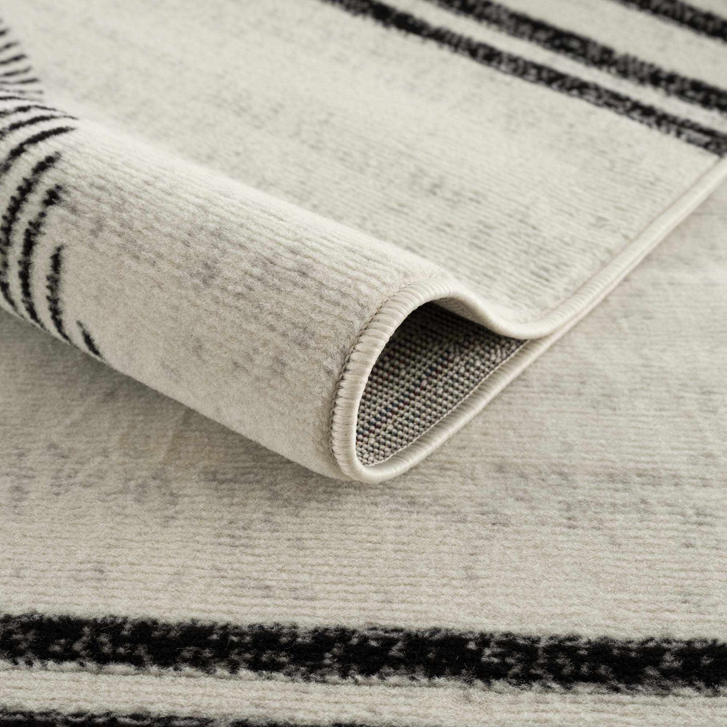 Angus Abstract Black and White Area Rug Hauteloom LLC