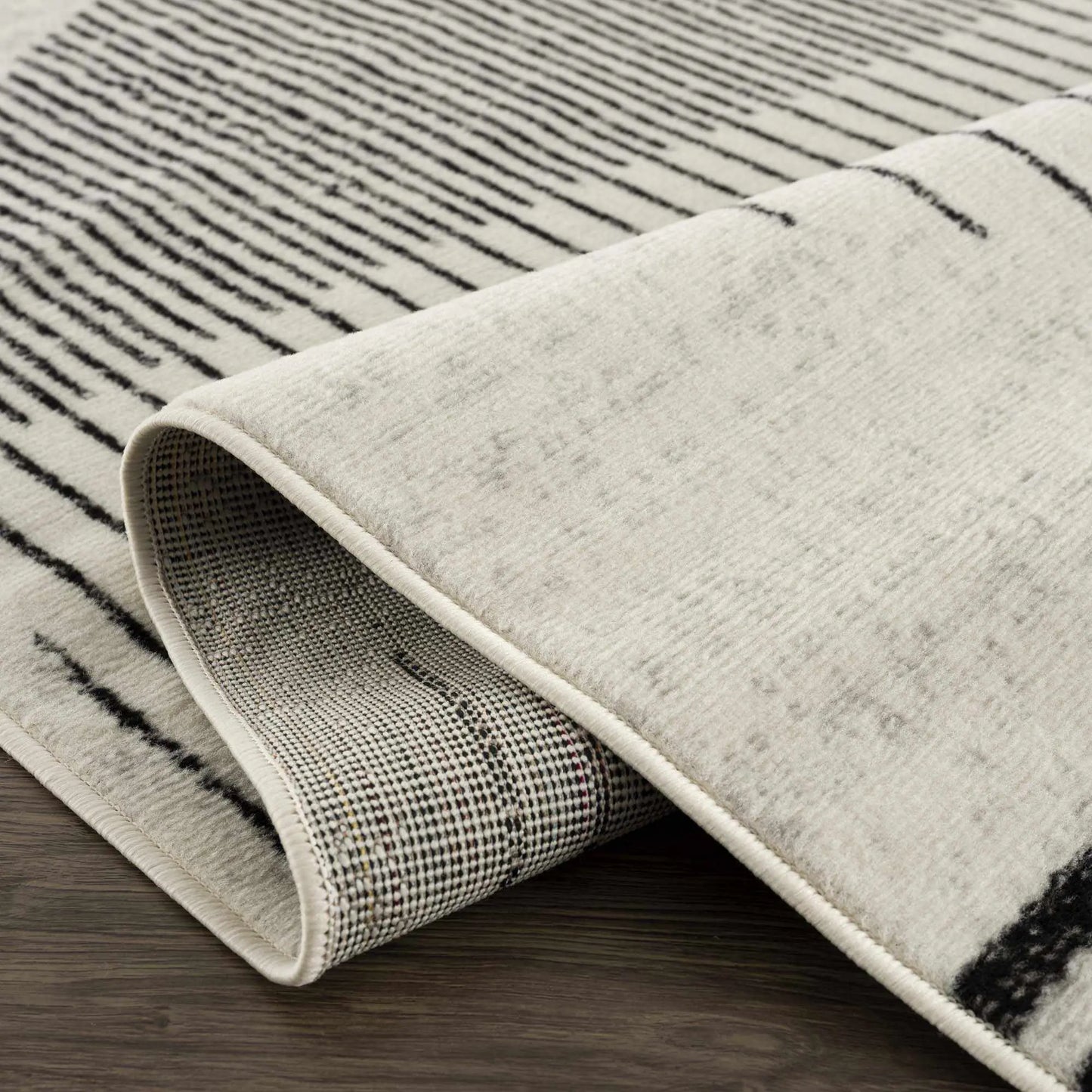 Angus Abstract Black and White Area Rug Hauteloom LLC