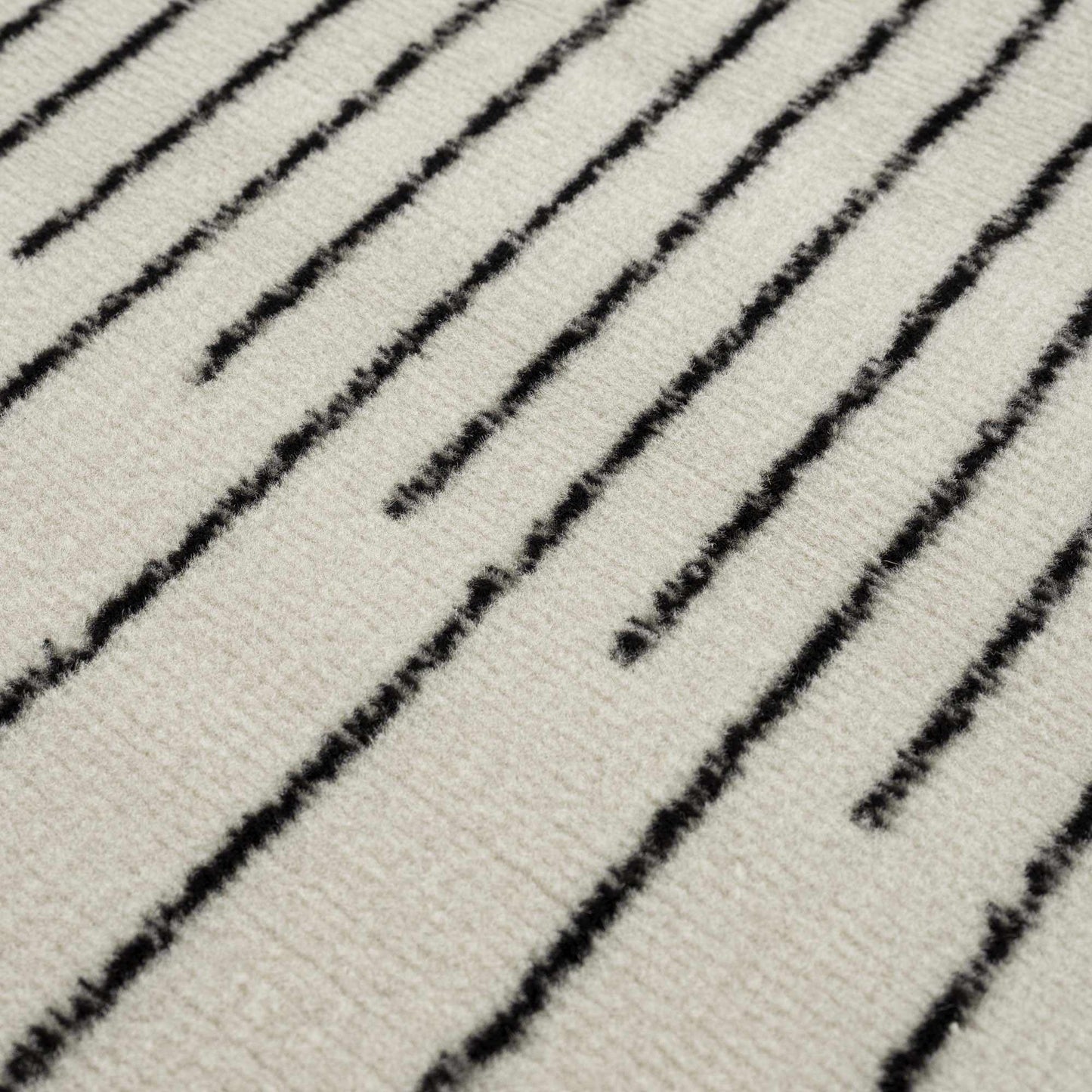 Angus Abstract Black and White Area Rug Hauteloom LLC