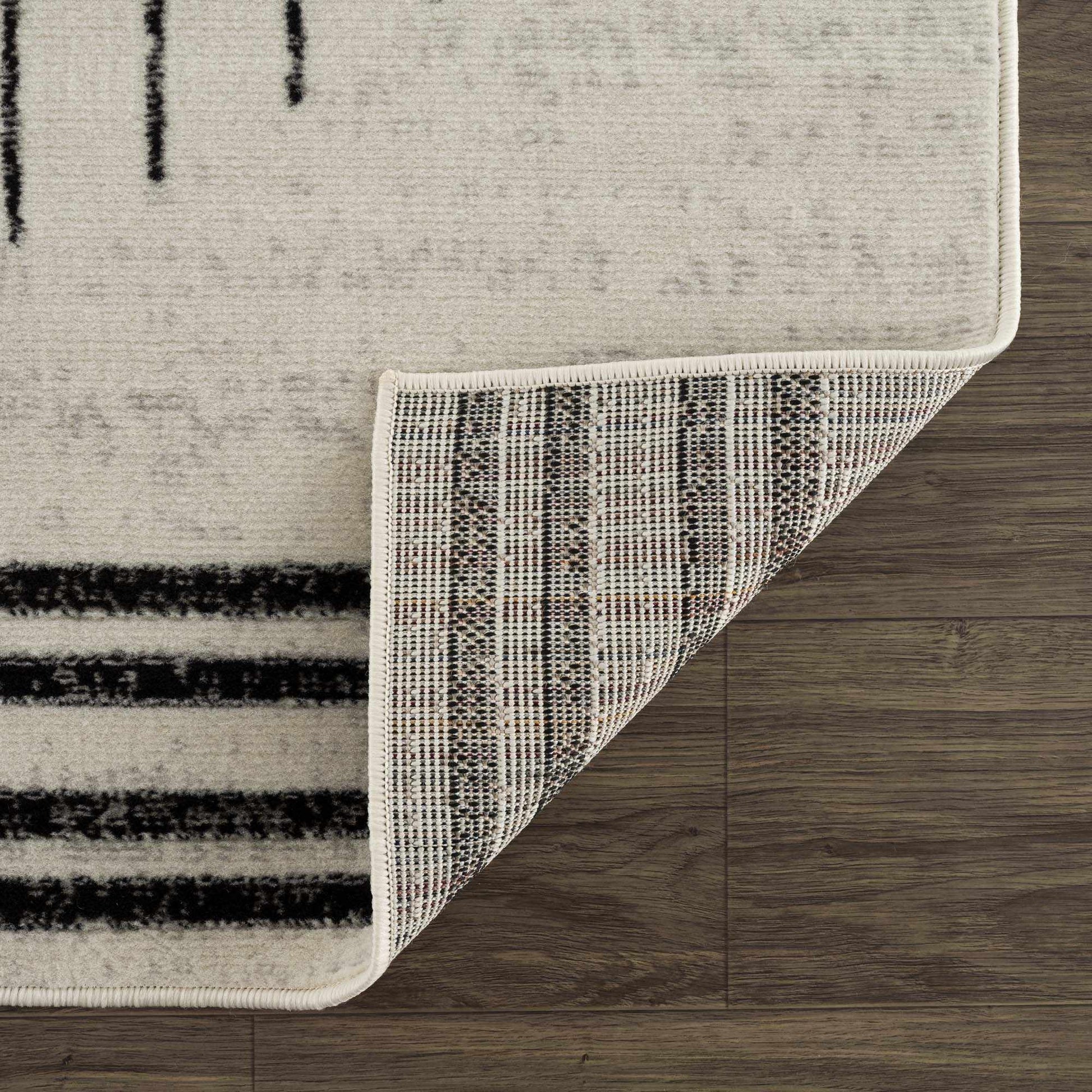 Angus Abstract Black and White Area Rug Hauteloom LLC